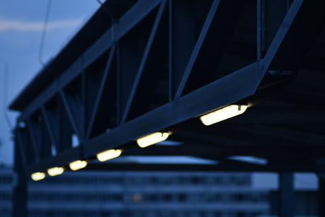a close up of a bridge with a building in the background