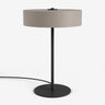 Moderne Studio Monton tafellamp met ronde beige kap en een slank zwart metalen voet